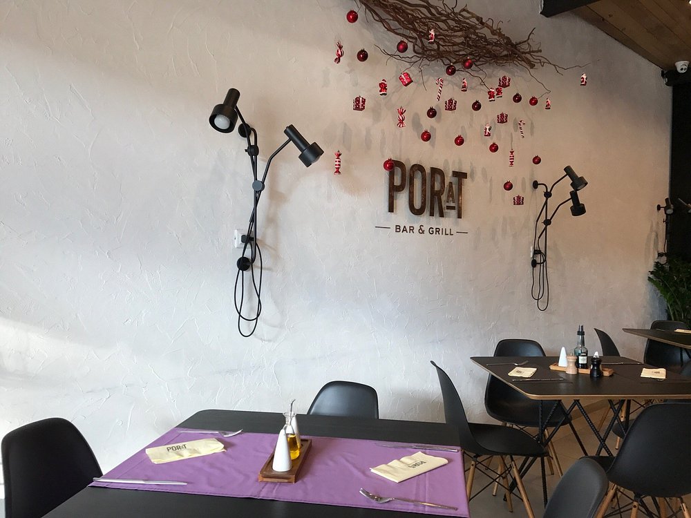 Zidne lampe STORK uz stolove u restoranu Porat